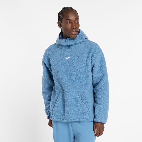Bluza męska New Balance MT44584HEB – niebieska. Niebieskie bluzy męskie New Balance, m, z aplikacjami, z materiału, z kapturem. Za 169.99 zł.