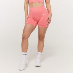 Szorty damskie fitness bezszwowe koralowe FLO. Czerwone szorty sportowe damskie GYMBEAM, s, bez wzorów, z elastanu, sportowe, na fitness i siłownię. Za 89.90 zł.