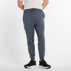 Spodnie męskie New Balance MP51905GT – szare. Szare spodnie sportowe męskie New Balance, m, bez wzorów, z materiału, na fitness i siłownię. Za 199.99 zł.