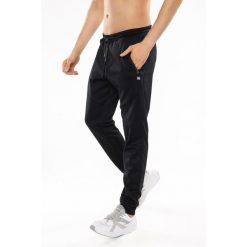Spodnie sportowe męskie Rough Radical Energy Long. Czarne spodnie sportowe męskie ROUGH RADICAL, l, bez wzorów, z dresówki, na fitness i siłownię. Za 159.90 zł.