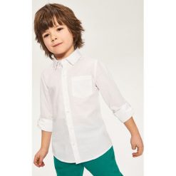 Elegancka koszula - Biały. Białe koszule damskie Reserved, bez wzorów, bez kołnierzyka, bez ramiączek. Za 79.99 zł.