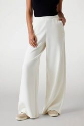 GUESS Spodnie damskie dresowe ecru Olympe Wide, Rozmiar S. Białe spodnie dresowe damskie Guess, s, z aplikacjami, z dresówki. W wyprzedaży za 354.99 zł.