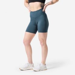 Spodenki do treningu siłowego damskie Domyos. Niebieskie szorty sportowe damskie DOMYOS, s, bez wzorów, z elastanu, z podwyższonym stanem, na fitness i siłownię. Za 119.99 zł.