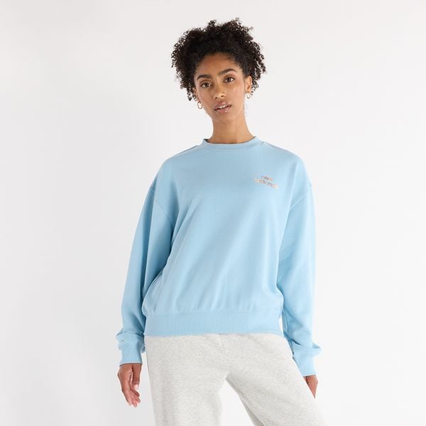 Bluza damska New Balance WT43559CUH – niebieska. Niebieskie bluzy damskie New Balance, xs, bez wzorów, z bawełny, bez kaptura. Za 129.99 zł.