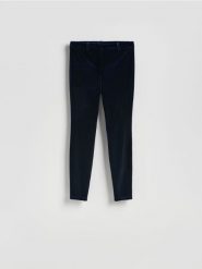 Welurowe spodnie - granatowy. Niebieskie spodnie materiałowe damskie Reserved, l, bez wzorów, z tkaniny. Za 179.99 zł.