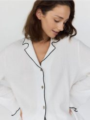 Góra od piżamy - złamana biel. Piżamy damskie Reserved, l, bez wzorów, z tkaniny, bez ramiączek. W wyprzedaży za 45.99 zł.