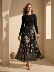 Rozkloszowana spódnica midi w kwiaty - wielobarwny. Spódnice damskie Sinsay, l, bez wzorów, midi, rozkloszowane. Za 49.99 zł.