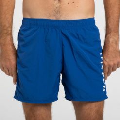 Szorty pływackie męskie Nabaiji 100 Basic. Niebieskie kąpielówki męskie NABAIJI, l, bez wzorów, z materiału, do pływania. Za 39.99 zł.
