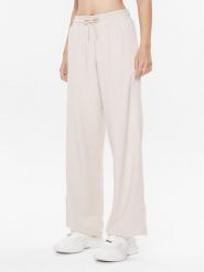 Tommy Hilfiger Spodnie dresowe UW0UW04771 Beżowy Relaxed Fit. Brązowe spodnie dresowe damskie Tommy Hilfiger, s, bez wzorów, z dresówki. Za 199.99 zł.