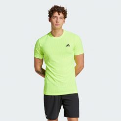 Koszulka Tennis Climacool+ AIRCHILL FreeLift. Żółte koszulki sportowe męskie Adidas, s, bez wzorów, bez kołnierzyka, bez ramiączek, tenisowe, climacool (adidas). Za 255.30 zł.