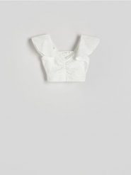 Bluzka z falbankami - złamana biel. Bluzki damskie Reserved, l, bez wzorów, z dzianiny, bez kołnierzyka, bez ramiączek. W wyprzedaży za 19.99 zł.