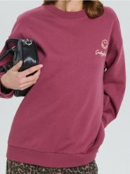 Bluza z nadrukiem na plecach SmileyWorld® - czerwony. Czerwone bluzy damskie Sinsay, l, bez wzorów, bez kaptura. W wyprzedaży za 27.99 zł.