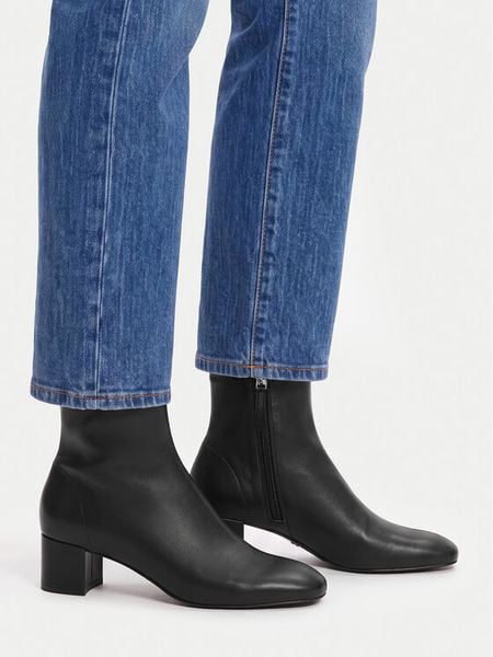 GINO ROSSI Botki C-TS6317-01 Czarny. Czarne botki damskie Gino Rossi, ze skóry, bez obcasa, na słupku, bez zapięcia. Za 349.99 zł.