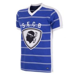 Koszulka piłkarska retro - Dorosły - SC Bastia 1981-82 - Niebieska. Niebieskie koszulki sportowe męskie COPA FOOTBALL, s, bez wzorów, bez kołnierzyka, bez ramiączek, do piłki nożnej. Za 340.84 zł.
