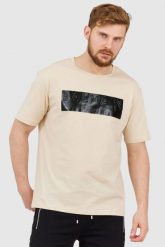 BALMAIN Beżowy t-shirt męski z aplikacją z logo. Brązowe t-shirty męskie Balmain, m, z aplikacjami, prążkowane, bez kołnierzyka. W wyprzedaży za 1,299.99 zł.