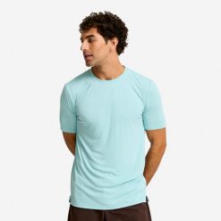 Koszulka fitness męska Domyos krótki rękaw. Niebieskie koszulki sportowe męskie DOMYOS, l, bez wzorów, z materiału, bez kołnierzyka, bez ramiączek, na fitness i siłownię. Za 52.49 zł.