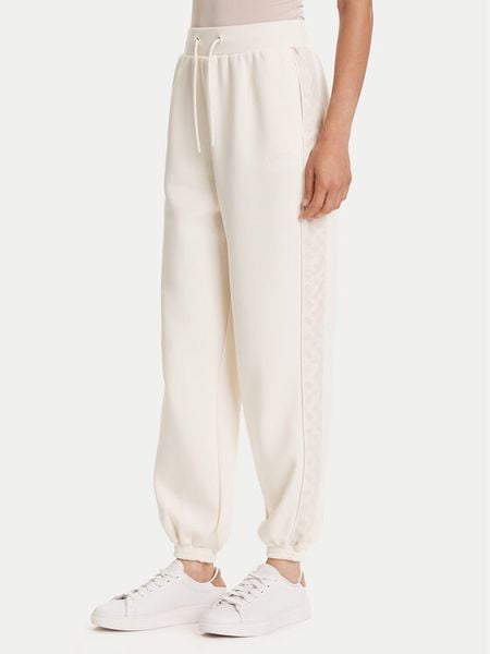 Guess Spodnie dresowe V5YB02 KB3P2 Écru Regular Fit. Białe spodnie dresowe damskie Guess, m, z aplikacjami, z bawełny. Za 217.99 zł.