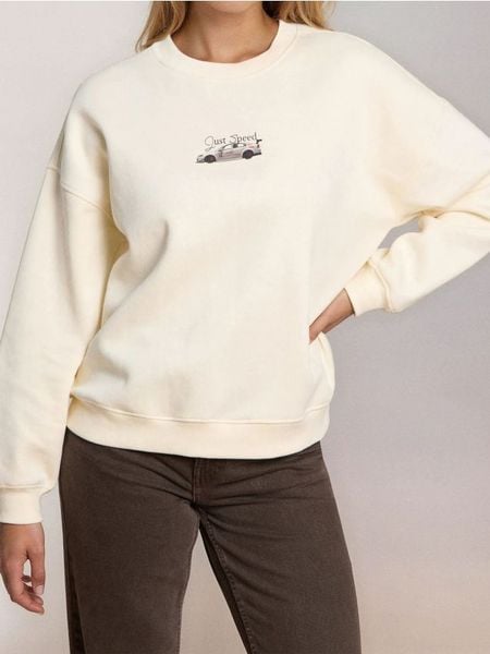 Bluza crewneck z nadrukiem - kremowy. Białe bluzy damskie Sinsay, l, bez wzorów, bez kaptura. Za 49.99 zł.