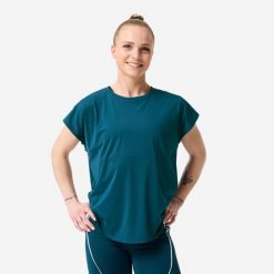 Koszulka fitness damska Domyos krótki rękaw. Niebieskie koszulki sportowe damskie DOMYOS, l, bez wzorów, z materiału, bez kołnierzyka, bez ramiączek, na fitness i siłownię. Za 59.99 zł.