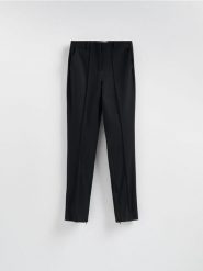 Spodnie z suwakami - czarny. Czarne spodnie materiałowe damskie Reserved, l, bez wzorów, z dzianiny. Za 139.99 zł.