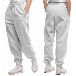 Damskie spodnie dresowe adidas Essentials 3-Stripes Fleece Loose-Fit. Szare spodnie dresowe damskie Adidas, bez wzorów, z bawełny. Za 178.99 zł.