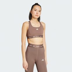 Biustonosz TECHFIT. Brązowe biustonosze Adidas, bez wzorów, z materiału. W wyprzedaży za 125.30 zł.