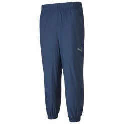 Męskie spodnie Puma Reactive Woven Pant niebieskie. Niebieskie spodnie sportowe męskie Puma, m, bez wzorów, z poliesteru, do piłki nożnej. Za 238.99 zł.