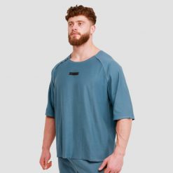 Koszulka męska fitness oversize niebieska Unity. Niebieskie koszulki sportowe męskie GYMBEAM, m, bez wzorów, z bawełny, bez kołnierzyka, bez ramiączek, na fitness i siłownię. Za 67.90 zł.