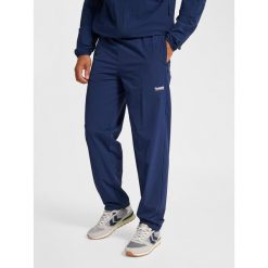 Spodnie dresowe Hummel Pulse. Niebieskie spodnie sportowe męskie Hummel, bez wzorów, z dresówki, na fitness i siłownię. Za 278.50 zł.