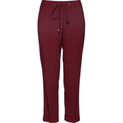 Spodnie 7/8 z wywiniętymi nogawkami bonprix czerwony klonowy. Spodnie materiałowe damskie marki bonprix. Za 79.99 zł.