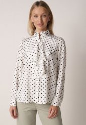 Biała Wiskozowa Koszula w Kropki ze Stójką z Ozdobnymi Falbanami Isamene. Białe bluzki damskie Born2be, m, bez wzorów, z jeansu, klasyczne, bez kołnierzyka, bez ramiączek. Za 129.99 zł.