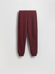 Spodnie dresowe jogger z bawełną - bordowy. Czerwone spodnie dresowe damskie Reserved, l, bez wzorów, z bawełny. W wyprzedaży za 49.99 zł.