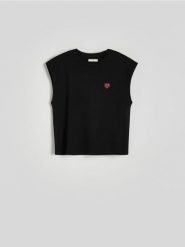 T-shirt z aplikacją - czarny. Czarne t-shirty damskie Reserved, l, z aplikacjami, z bawełny, bez kołnierzyka. W wyprzedaży za 29.99 zł.