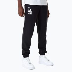 Spodnie męskie New Era MLB Essentls Jogger Los Angeles Dodgers. Czarne spodnie sportowe męskie New Era, m, bez wzorów. Za 199.99 zł.