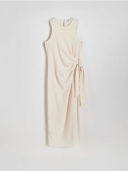 Sukienka midi z wiązaniem - kremowy. Białe sukienki damskie Reserved, na co dzień, l, bez wzorów, z tkaniny, bez kołnierzyka, bez ramiączek, midi, proste. W wyprzedaży za 65.99 zł.