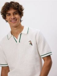 Ażurowy sweter polo - złamana biel. Swetry przez głowę męskie Reserved, l, w ażurowe wzory, z bawełny, bez kołnierzyka. Za 139.99 zł.