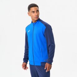 Bluza piłkarska Kipsta Essential Club. Niebieskie bluzy męskie KIPSTA, xl, bez wzorów, z elastanu, bez kaptura, na fitness i siłownię. Za 79.99 zł.