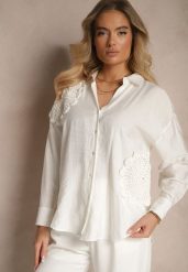 Biała Koszula Oversize z Lnu i Wiskozy Zdobiona Aplikacjami z Kwiatami Varreia. Białe bluzki damskie Renee, m, z aplikacjami, z jeansu, eleganckie, bez kołnierzyka, bez ramiączek. Za 69.99 zł.
