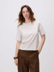 T-shirt z bawełną - beżowy. Brązowe t-shirty damskie Reserved, l, bez wzorów, z bawełny, klasyczne, bez kołnierzyka. Za 59.99 zł.