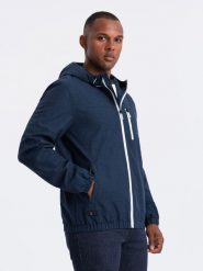 Lekka sportowa kurtka męska z polarową podszewką – granatowa V2 OM-JANP-0136 - XXL. Niebieskie kurtki męskie Ombre Clothing, l, z aplikacjami, z gumy, sportowe. W wyprzedaży za 189.99 zł.