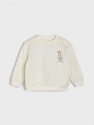 Bawełniana bluza crewneck z nadrukiem Minnie Mouse - kremowy. Białe bluzy dla niemowląt Sinsay, bez wzorów, z bawełny, bez ramiączek, bez kaptura. Za 15.99 zł.