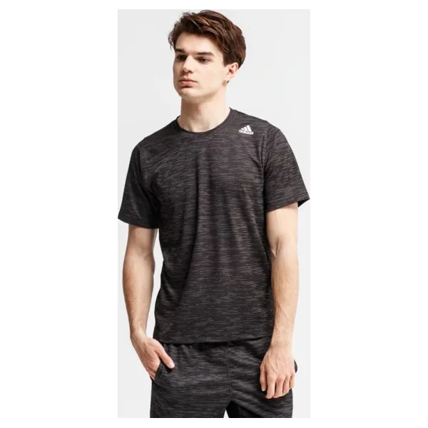 Adidas Koszulka Ss Fl Tec Z Ft Hea , szary, rozmiar M. Szare koszulki sportowe męskie Adidas, m, bez wzorów, z materiału, bez kołnierzyka, bez ramiączek, na fitness i siłownię. W wyprzedaży za 99.99 zł.
