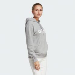Bluza z kapturem Essentials Linear. Białe bluzy sportowe damskie Adidas, s, bez wzorów, z kapturem, na fitness i siłownię. Za 199.00 zł.