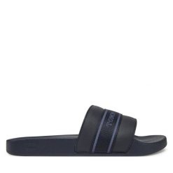 Klapki Tommy Hilfiger. Niebieskie klapki damskie Tommy Hilfiger, bez wzorów, bez obcasa. Za 99.99 zł.