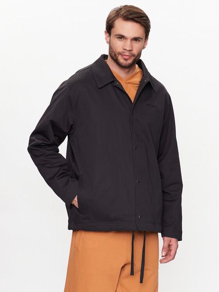 New Balance Kurtka przejściowa MJ23552 Czarny Relaxed Fit. Czarne kurtki męskie New Balance, m, bez wzorów, z bawełny, bez kaptura. Za 419.99 zł.