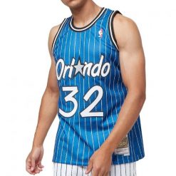 Koszulka do koszykówki męska Mitchell & Ness Orlando Magic NBA Swingman. Niebieskie koszulki sportowe męskie Mitchell & Ness, m, bez wzorów, z jersey, bez kołnierzyka, bez ramiączek, do koszykówki. Za 559.00 zł.