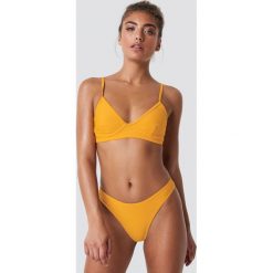 NA-KD Swimwear Dół bikini z wycięciami - Yellow. Żółte bikini damskie NA-KD Swimwear. Za 40.95 zł.
