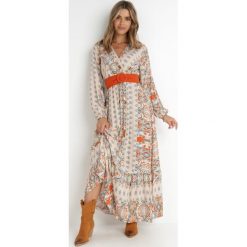 Jasnobeżowa Sukienka Rozkloszowana z Paskiem Nazene. Brązowe sukienki damskie Born2be, l, bez wzorów, z materiału, boho, bez kołnierzyka, bez ramiączek, maxi, kopertowe. Za 139.99 zł.