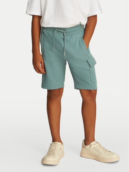 Calvin Klein Jeans Szorty sportowe IB0IB02440 Zielony Relaxed Fit. Zielone szorty dla chłopców Calvin Klein Jeans, bez wzorów, z bawełny, sportowe. Za 249.99 zł.