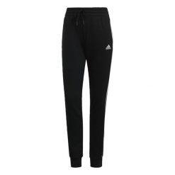 Spodnie damskie adidas ESSENTIAL 3-STRIPES. Białe spodnie materiałowe damskie Adidas, s, bez wzorów, z bawełny. Za 129.99 zł.